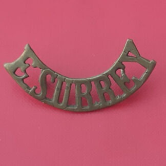 The East Surrey Regiment - Gilding Metal Shoulder Title.