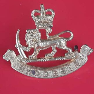 The Rhodesia & Nyasaland Staff Corps - Queen's Crown Gilding Metal Cap Badge