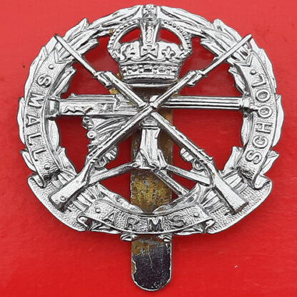 The Small Arms School - King's Crown Chromed Cap Badge