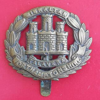 The Northamptonshire Regiment - Economy Issue Gilding Metal Cap Badge