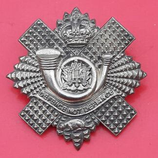 (Canada) The Highland Light Infantry Of Canada - King's Crown White Metal Cap Badge
