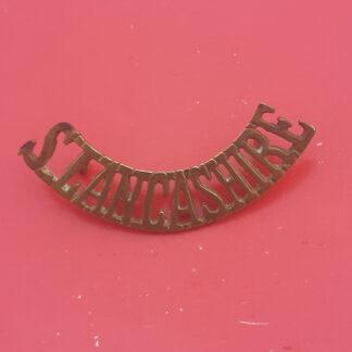 The South Lancashire Regiment - Gilding Metal Shoulder Title.