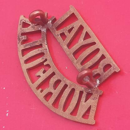 The Royal Norfolk Regiment - Gilding Metal Shoulder Title. - Image 2