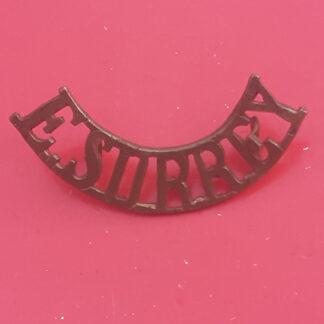 The East Surrey Regiment - Gilding Metal Shoulder Title.