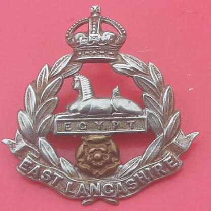The East Lancashire Regiment - King's Crown Edwardian Bi-Metal Cap Badge.
