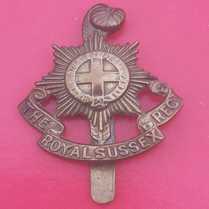 The Sussex Regiment - WW1 Economy King's Crown Gilding Metal Cap Badge.