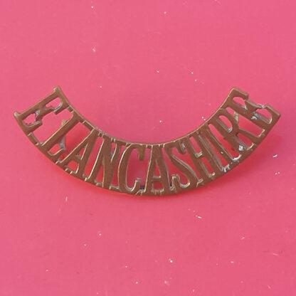 The East Lancashire Regiment - Gilding Metal Shoulder Title.