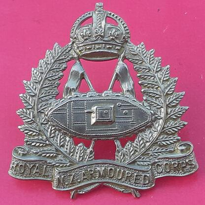 (New Zealand) - The Royal New Zealand Armoured Corps - King's Crown White Metal Cap Badge.