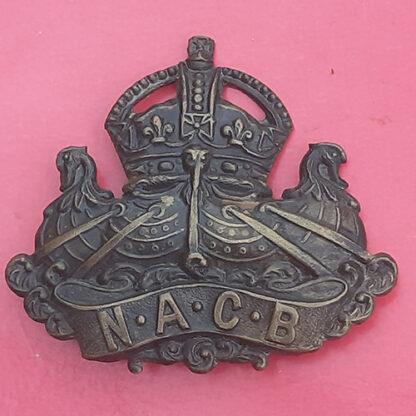 The Navy & Army Canteen Board - WW1 Gilding Metal Cap Badge.
