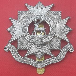 The Bedfordshire & Hertfordshire Regiment - White Metal Cap Badge.