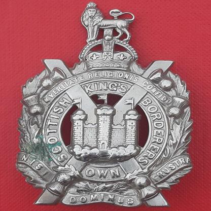 The King's Own Scottish Borderers - King's Crown White Metal Cap Badge.
