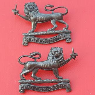 The Herefordshire Regiment - Officer's Service Dress Bronze Collar Badges.