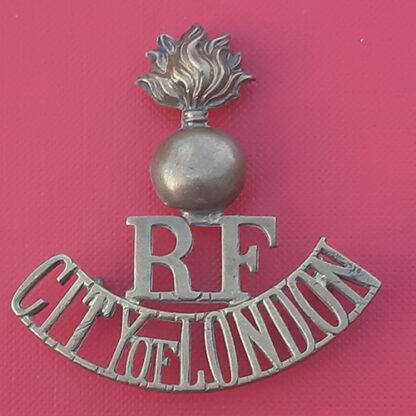 The Royal Fusiliers (City Of London) - Gilding Metal Shoulder Title.