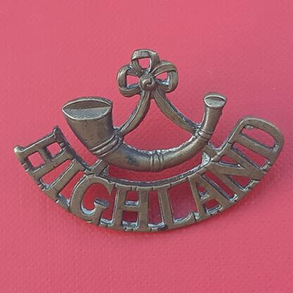 The Highland Light Infantry Gilding Metal Shoulder Title.