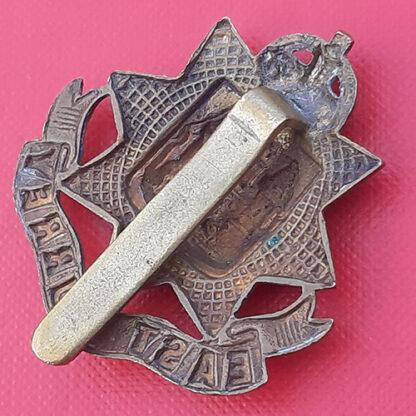 The East Surrey Regiment - King's Crown WW1 Economy Issue Gilding Metal Cap Badge. - Image 2