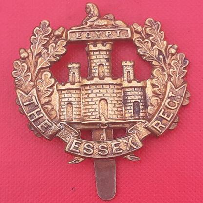 The Essex Regiment - WW1 Economy Gilding Metal Cap Badge.