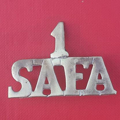(South Africa) 1st South African Field Artillery - Sheet Brass Metal Shoulder Title.