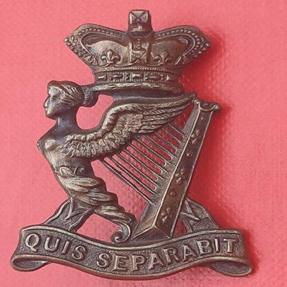 The Royal Irish Rifles - Queen Victoria's Crown Gilding Metal Field Service Cap Badge.