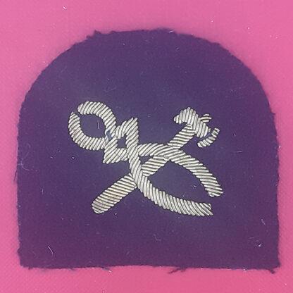 Royal Marines Armourer - Gold Wire Bullion On Navy Blue Cloth Trade Badge.