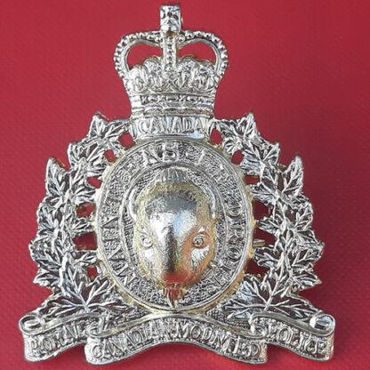 (Canada) Royal Canadian Mounted Police - Queen's Crown  Gold Anodised Cap Badge.