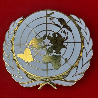 The United Nations - Enamelled Metal Cap Badge.