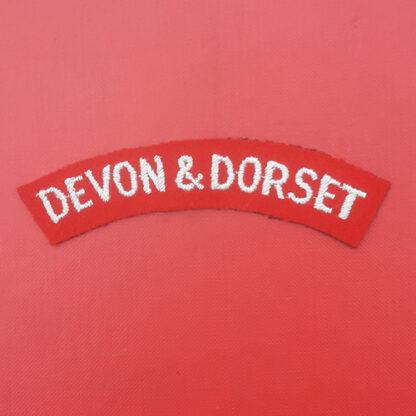 The Devon & Dorset Regiment - Woven Cloth Shoulder Title.