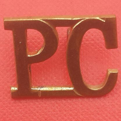 The Pioneer Corps - Gilding Metal Shoulder Title.