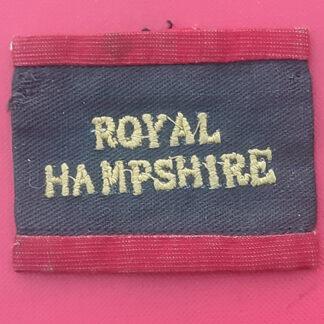 The Royal Hampshire Regiment - Black On Red Woven Slipover Shoulder Badge.