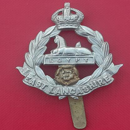 The East Lancashire Regiment - King's Crown Bi Metal Cap Badge.