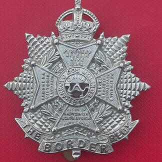 The Border Regiment - King's Crown White Metal Cap Badge.