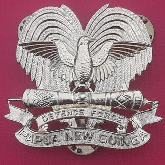 Papua & New Guinea Defence Force - Gold Anodised Cap Badge.