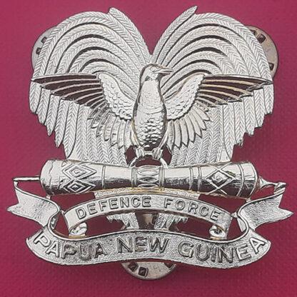 Papua & New Guinea Defence Force - Gold Anodised Cap Badge.
