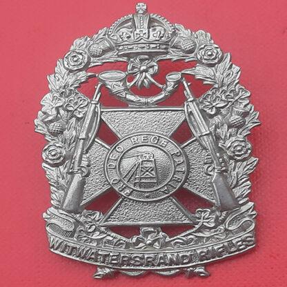 (South Africa) The Witwatersrand Rifles - King's Crown White Metal Helmet Badge.