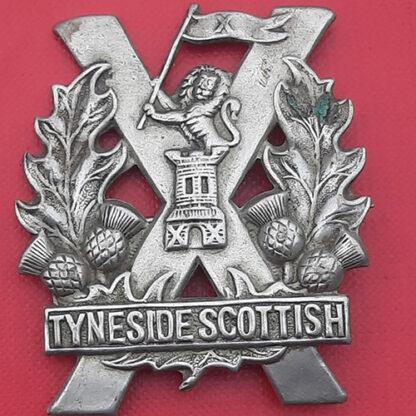 Tyneside Scottish - 4th Pattern White Metal Cap Badge.