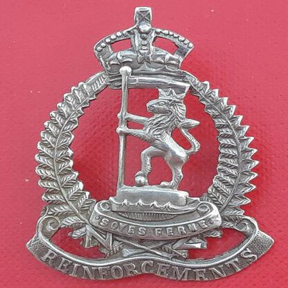 (New Zealand)  Reinforcements Rifle Brigade - King's Crown White Metal Cap Badge.