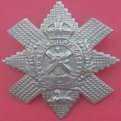 The Royal Highlanders (The Black Watch) - King's Crown White Metal Cap Badge.