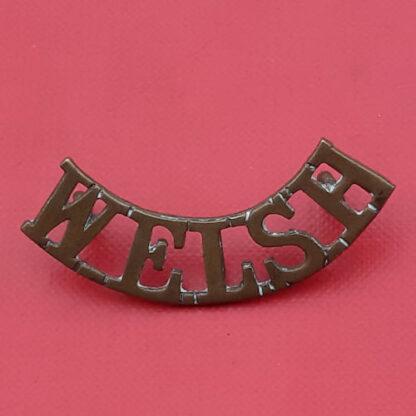 The Welsh Regiment - WW1 Gilding Metal Shoulder Title.