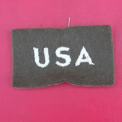 (U.S.A) United States Of America - White On Khaki Cloth WW2 Nationality Badge.