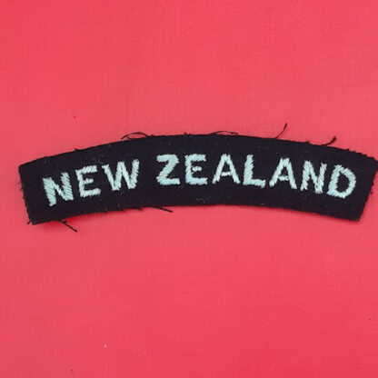 (New Zealand) New Zealand Royal Air Force - Light Blue On Black Cloth Nationality Badge.
