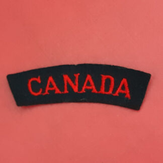(Canada) - Red On Black Cloth Nationality Badge.