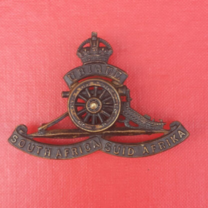 (South Africa) The South African Artillery - King's Crown Blackened Brass Cap Badge.