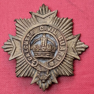 (India) The Calcutta Civil Guard - Cast Gilding Metal Cap Badge.