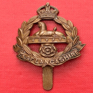 The East Lancashire Regiment - WW1 Economy Issue King's Crown Gilding Metal Cap Badge.