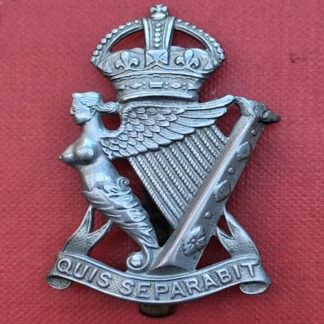 The Royal Irish Rifles - King's Crown White Metal Cap Badge.