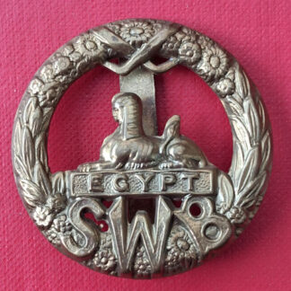 The South Wales Borderers - WW1 Economy Issue Gilding Metal Cap Badge.