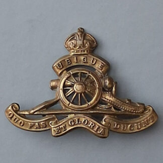The Royal Artillery - King's Crown Gilding Metal  Cap Badge.